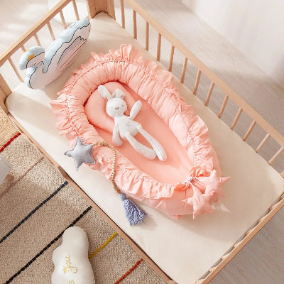 reducteur-de-lit-bebe-rose